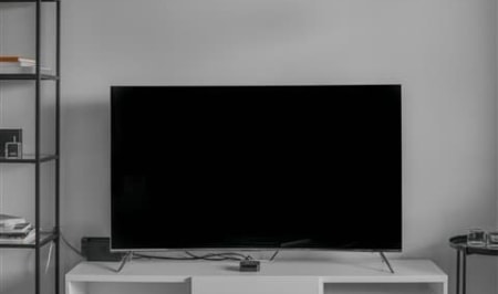 A flat screen tv sitting in a living room