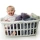 A baby sitting in a basket